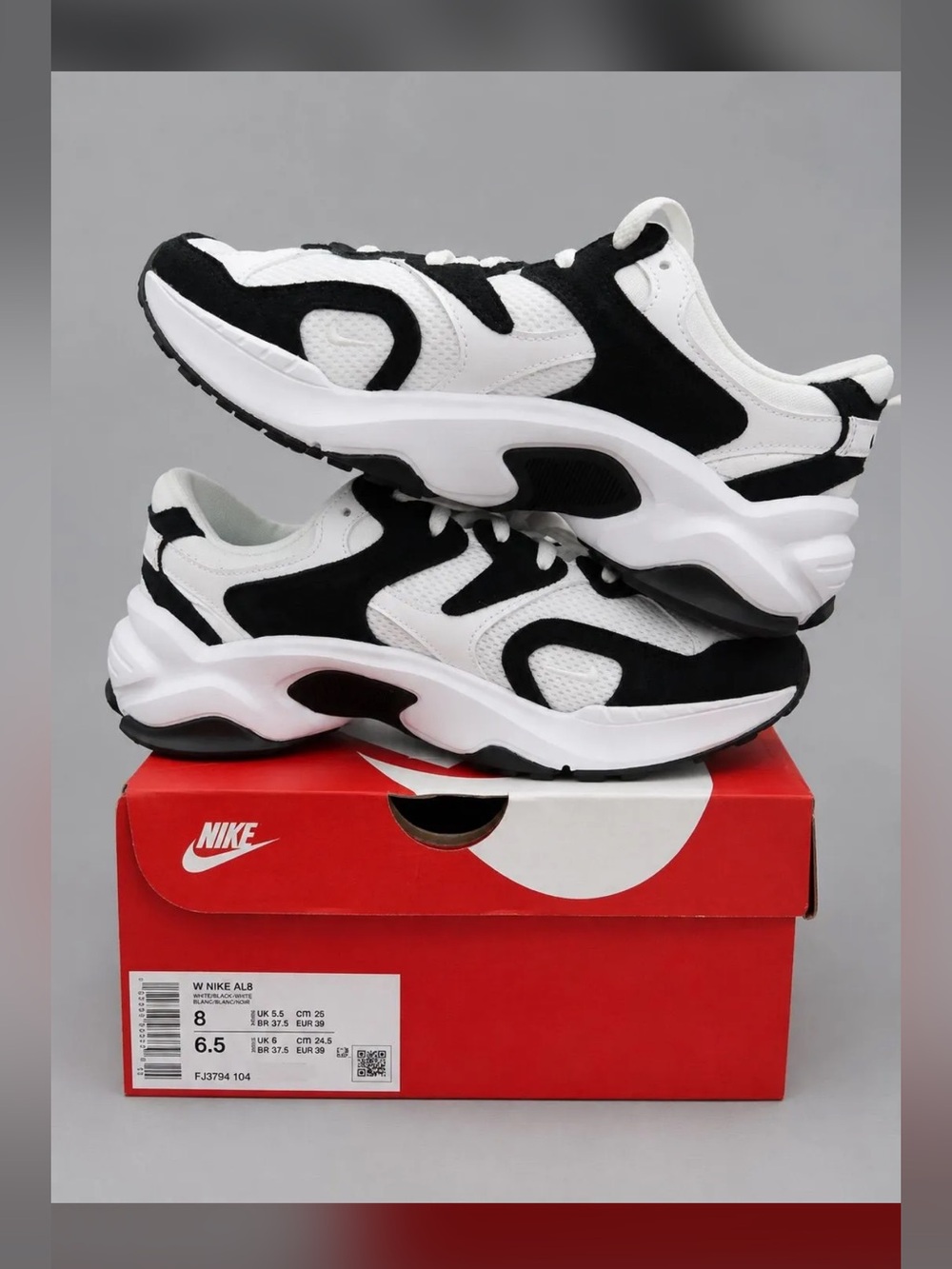 Nike women’s black and White Retro-Runner Sneakers